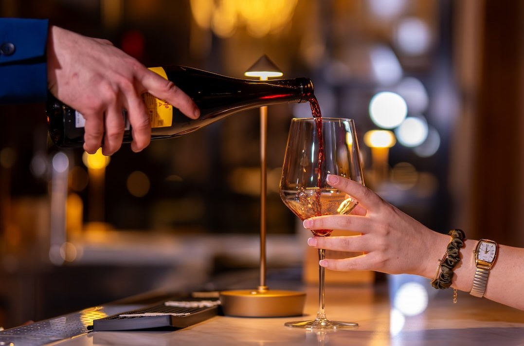 Wine being poured into a glass