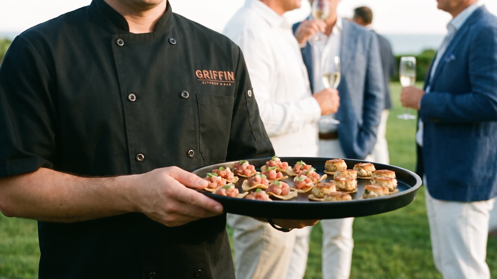 A server passing a tray of hors d'oeuvres