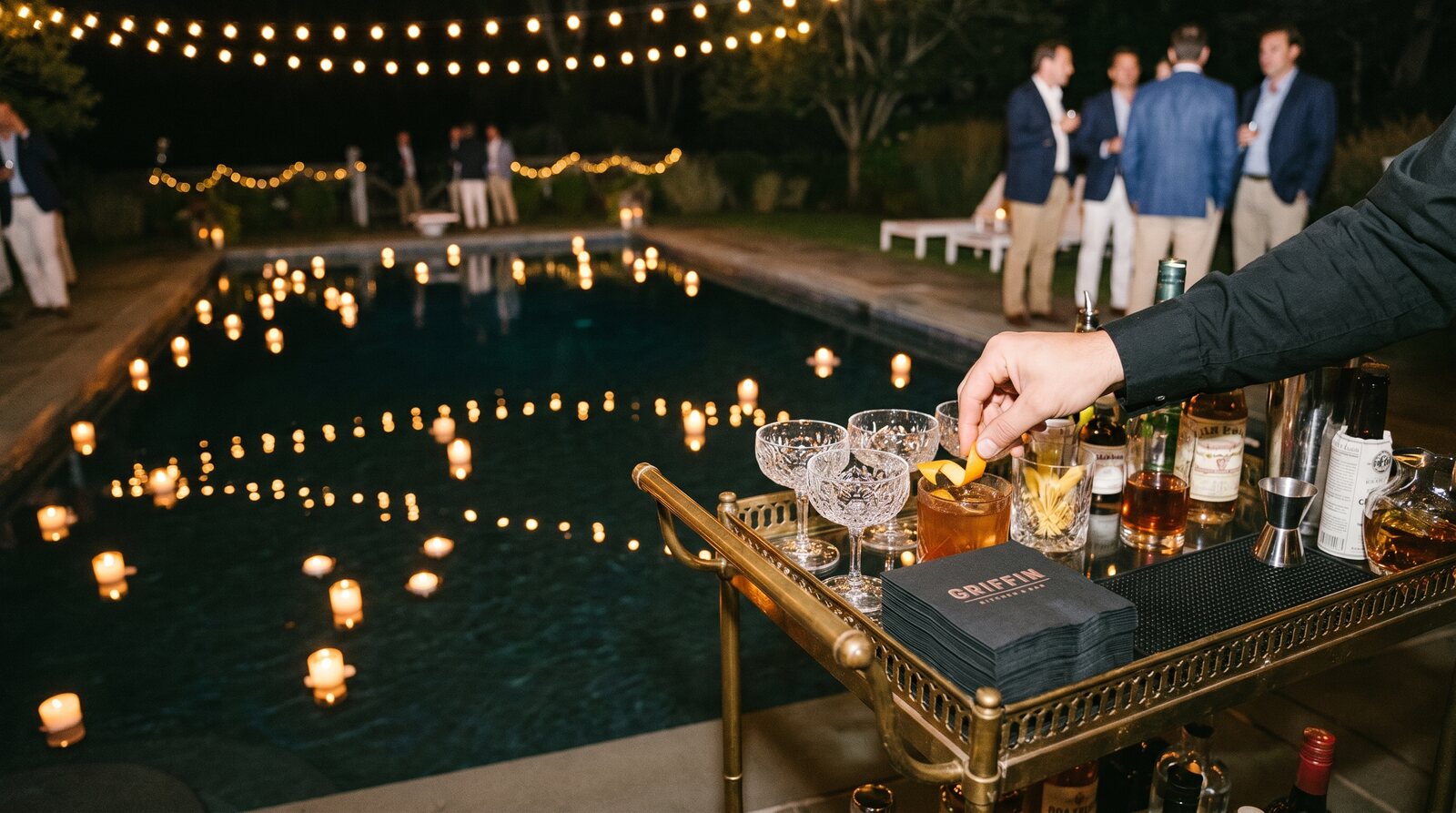 Pool at night with bar cart